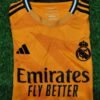 Real Madrid Fly Emirates Orange Football Jersey - Fan Edition